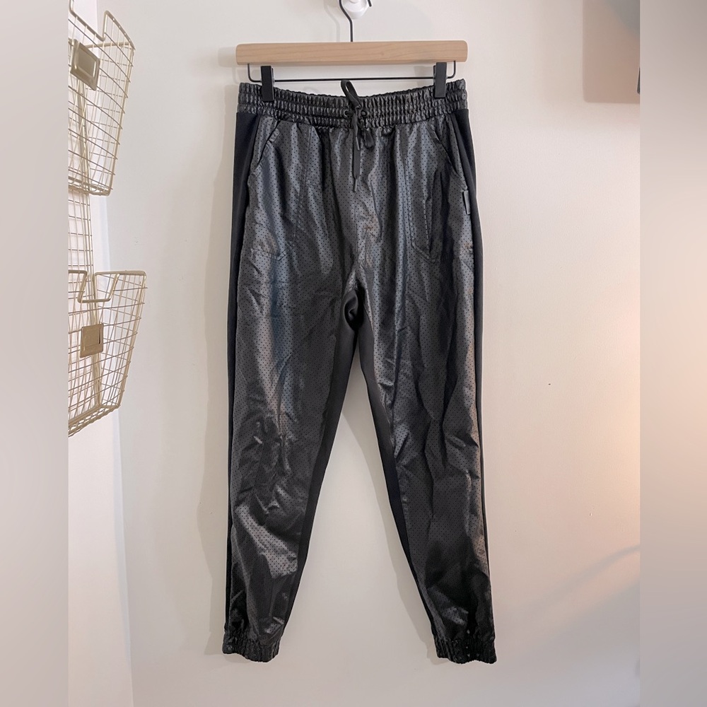Reebok - black patent leather in front and joggers style in rear